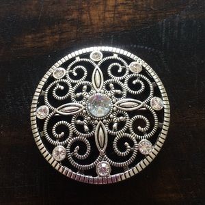 Silver brooch with clear stones