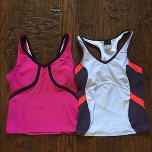 Four Women's Nike athletic tops in size XS