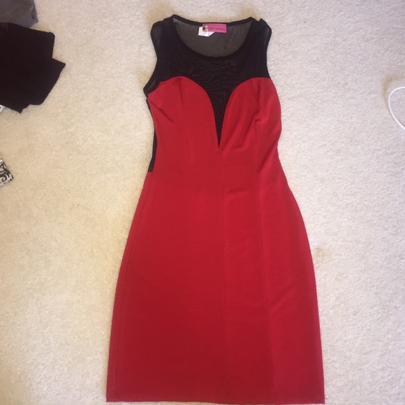 Red form fitting dress with black sheer