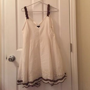 White dress with eyelet lining the bottom