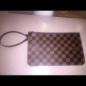 Brand new never worn Louis Vuitton clutch