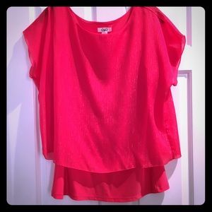 Sheer work top. Pink or coral color.