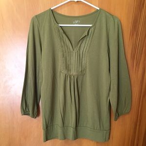 Pea Green shirt, with detailing on the neck!