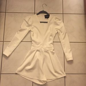 White romper with pockets.