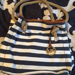 Navy blue and white striped Michael Kors bag