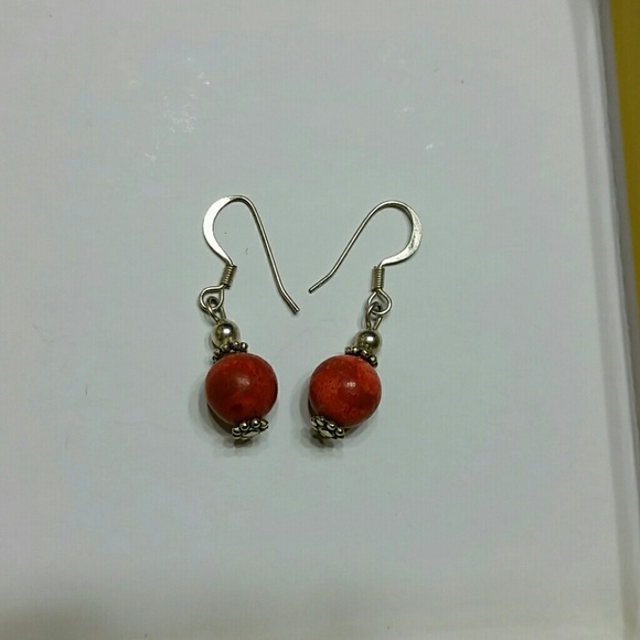 Small orange stone silver earrings.