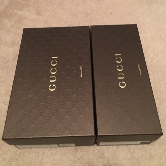 2 empty Gucci shoe boxes.