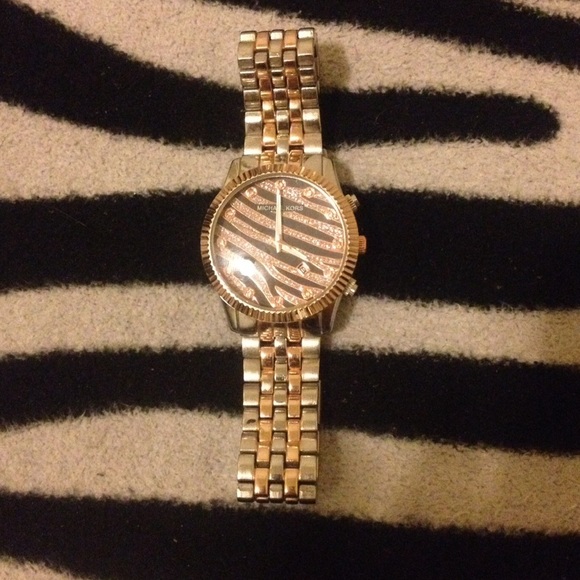 A Michael Kors gold and silver zebra print watch