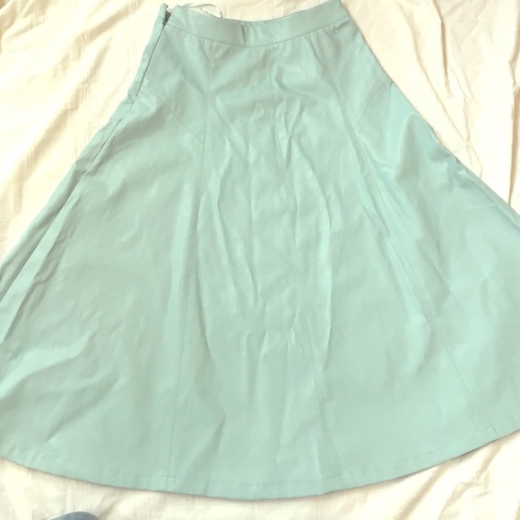 Baby blue leather, mid calf skirt.