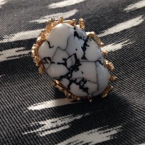 Black, white and gold ring