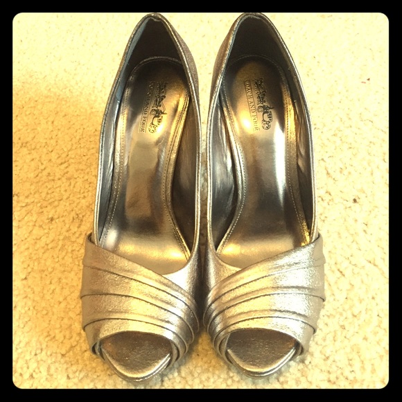 coach and four open toed platforms.