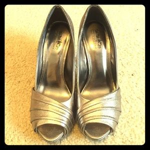 coach and four open toed platforms.