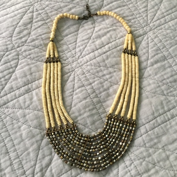 Tribal silver gold bone layer statement necklace.