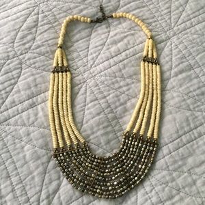 Tribal silver gold bone layer statement necklace.