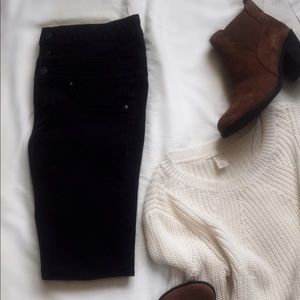 High-waisted black jeans.