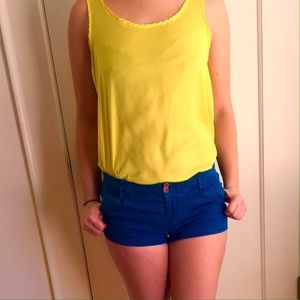 Express Yellow statement tank ••• Teal shorts