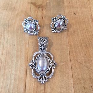 Silver tone earrings and matching pendant
