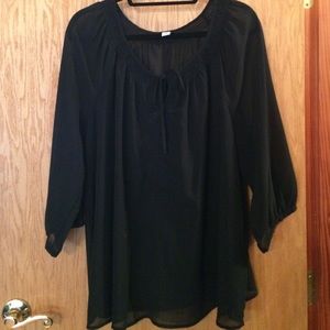 Sheer black top with tie in front detail.