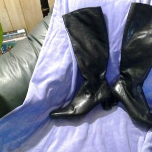 Black knee high heel boots.