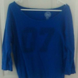 Blue shirt with 07 numbers in black on it