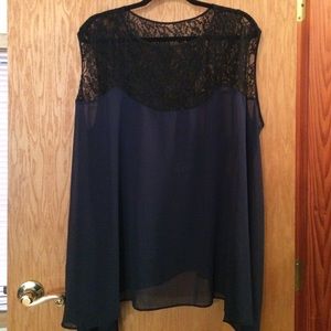 Blue top with black lace detail.