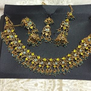 Necklaces earrings and head piece