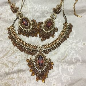 Necklaces earrings and head piece
