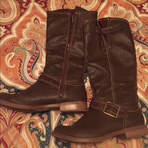Brown riding boots.