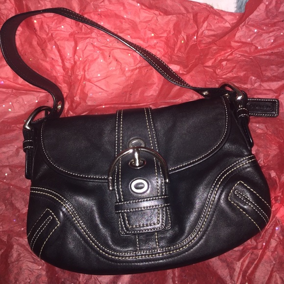 Black leather COACH purse with silver buckle