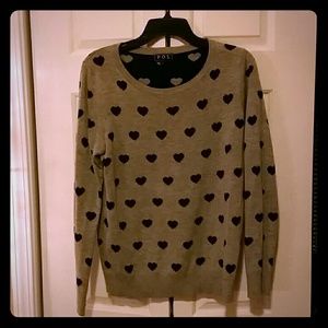 Gray sweater polka-dotted with black hearts