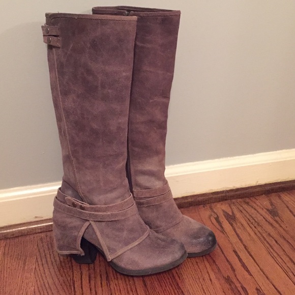 Calf height distressed leather boots.