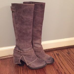 Calf height distressed leather boots.