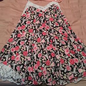 Black dress with pink flower design and white lace