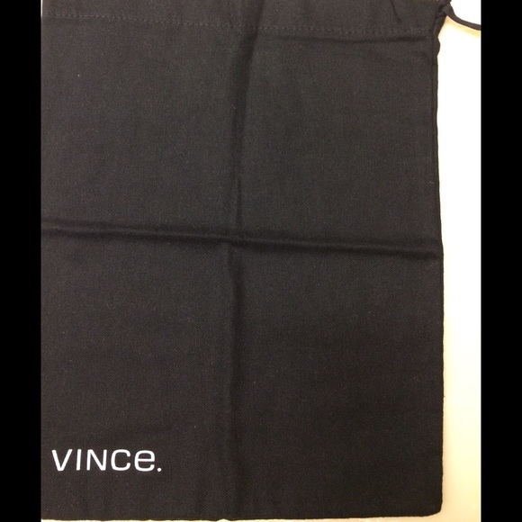 Vince black shoe of purse dust bag two together.