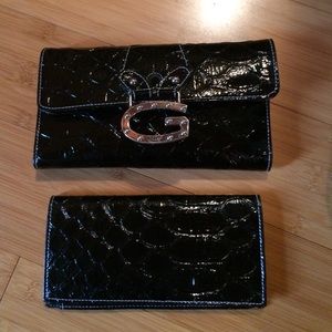 Guess wallet and checkbook in black.