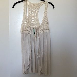 Cream colored crochet shirt/vest.