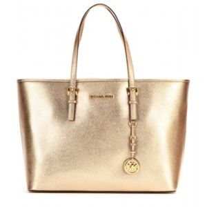 Gold Michael Kors jet set travel metallic tote