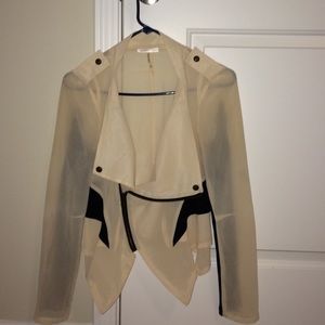 Sheer cream and black jacket.