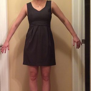 Grey dress with cinched waist and pleats