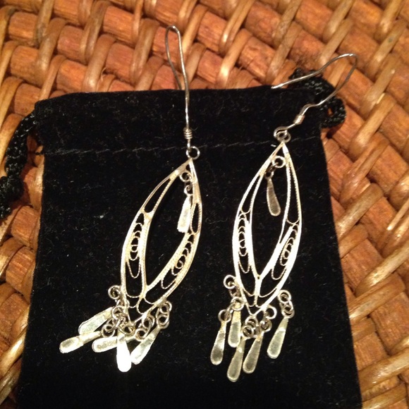 Delicate gold drop earrings.
