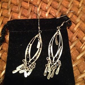 Delicate gold drop earrings.