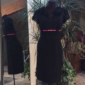 Black dress with sheer top.