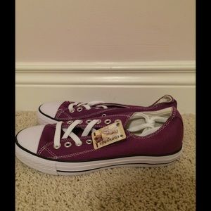 Brand new purple low top converse.