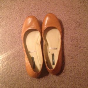Brown leather flats