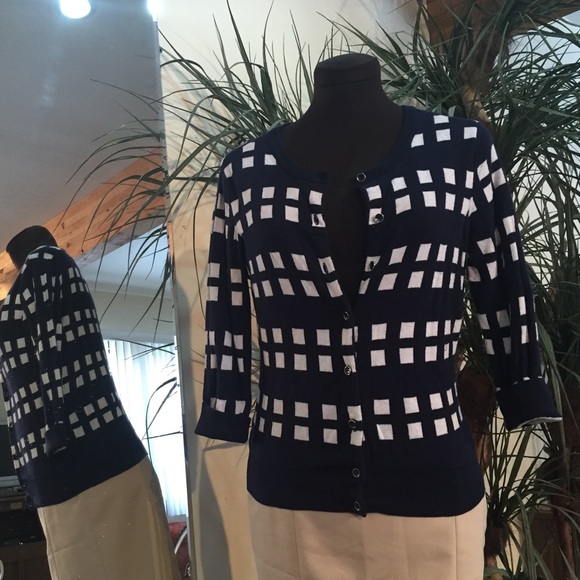 Navy and white checkered cardigan.