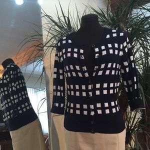 Navy and white checkered cardigan.