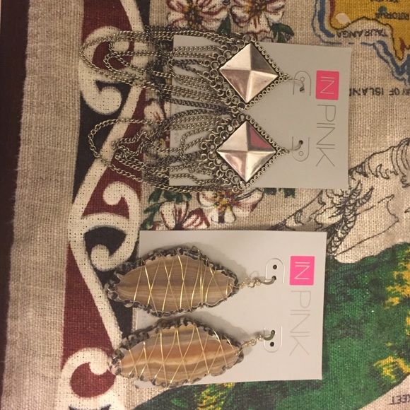 In pink earrings set of two never worn