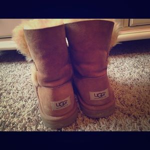Short tan button UGGs