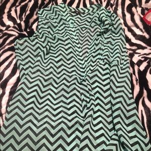 bluish greenish and black sleeveless blouse