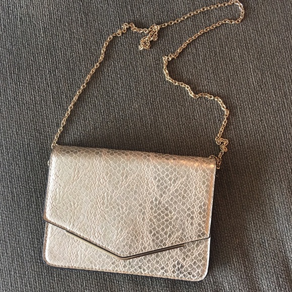 Cute little gold colored cross body bag